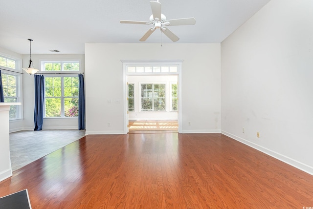 unfurnished room featuring ceiling fan and hardwood / wood-style floors