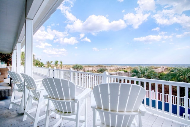 balcony with a deck with water view