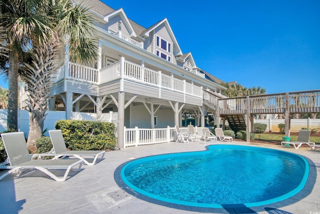 view of swimming pool with a patio