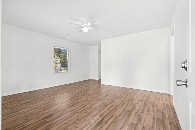 unfurnished room with hardwood / wood-style floors and ceiling fan