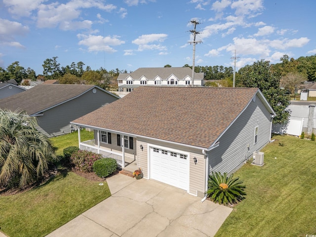 view of front of house featuring a front yard, central air condition unit, and a porch