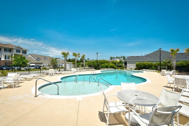 view of swimming pool with a patio area