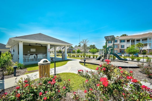 surrounding community with a playground and a lawn