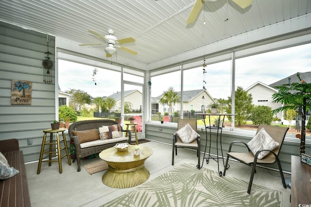 sunroom / solarium featuring ceiling fan and a wealth of natural light