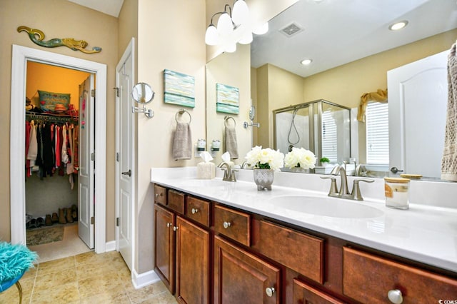 bathroom with walk in shower and vanity