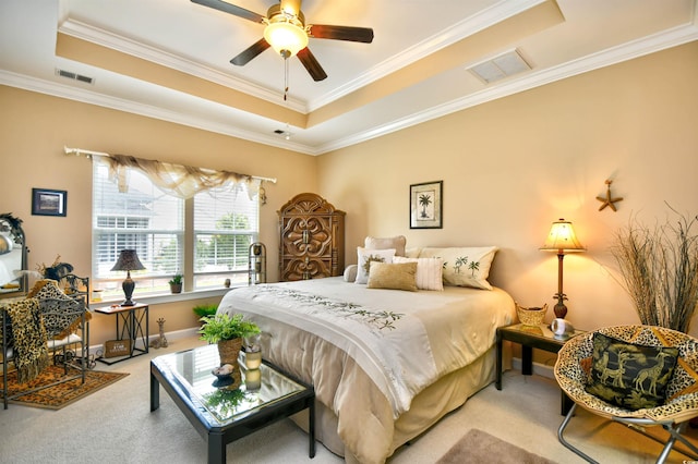 bedroom featuring ceiling fan, a tray ceiling, and crown molding