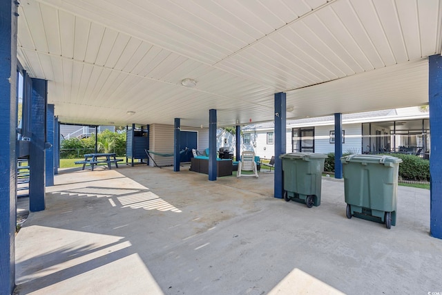 view of patio featuring an attached carport