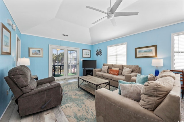 living room featuring vaulted ceiling, hardwood / wood-style flooring, and ceiling fan