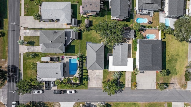 birds eye view of property with a residential view