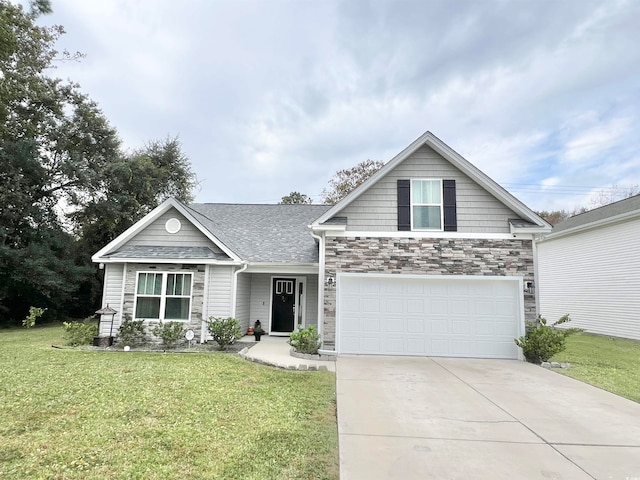 view of front of house featuring a front lawn and a garage