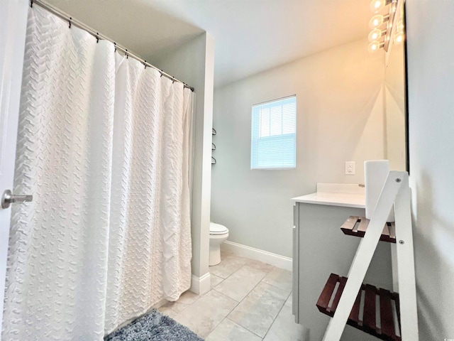 bathroom with vanity, toilet, and walk in shower