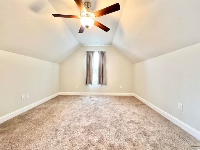 bonus room featuring lofted ceiling, carpet floors, and ceiling fan