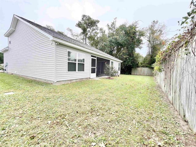 view of yard with a sunroom