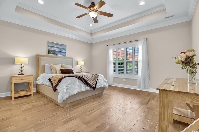 1002 Summers Pl, North Myrtle Beach, SC 29582 - bedroom with a tray ceiling, light wood-style floors, visible vents, and crown molding