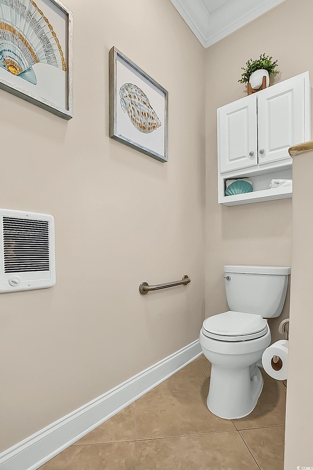 1002 Summers Pl, North Myrtle Beach, SC 29582 - bathroom with tile patterned floors, heating unit, toilet, crown molding, and baseboards