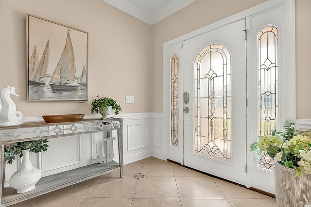 1002 Summers Pl, North Myrtle Beach, SC 29582 - entryway featuring crown molding, a wainscoted wall, a wealth of natural light, and light tile patterned flooring