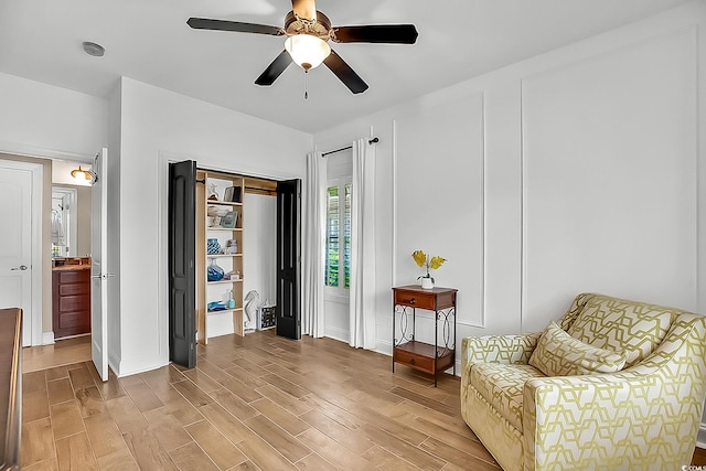 1002 Summers Pl, North Myrtle Beach, SC 29582 - living area with light wood finished floors, baseboards, and ceiling fan