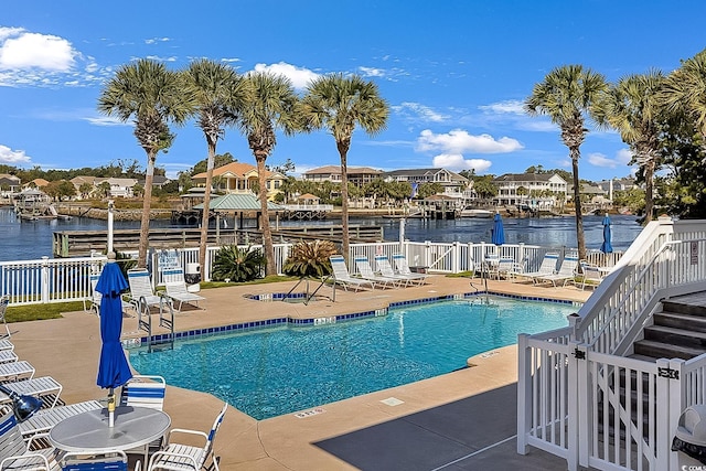 1002 Summers Pl, North Myrtle Beach, SC 29582 - pool with fence, a water view, a residential view, and a patio