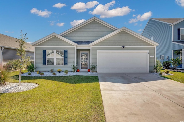 view of front facade with a garage and a front yard