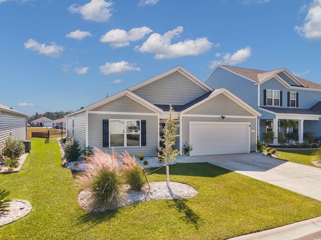 view of front of home featuring a garage and a front lawn