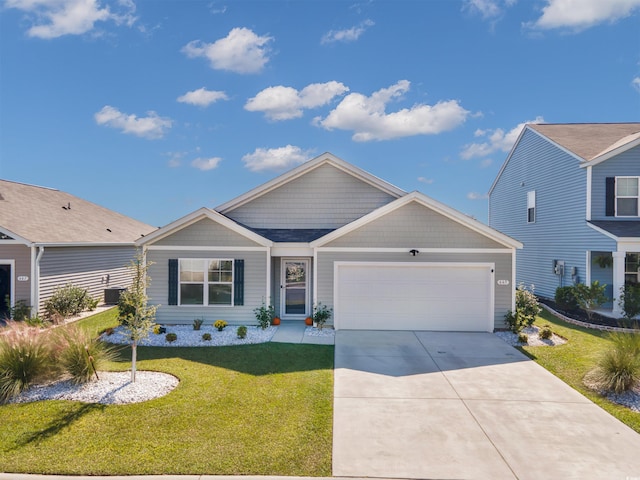 view of front of property with a garage and a front yard