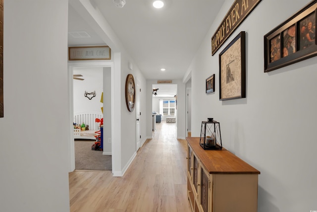 hallway featuring light hardwood / wood-style flooring