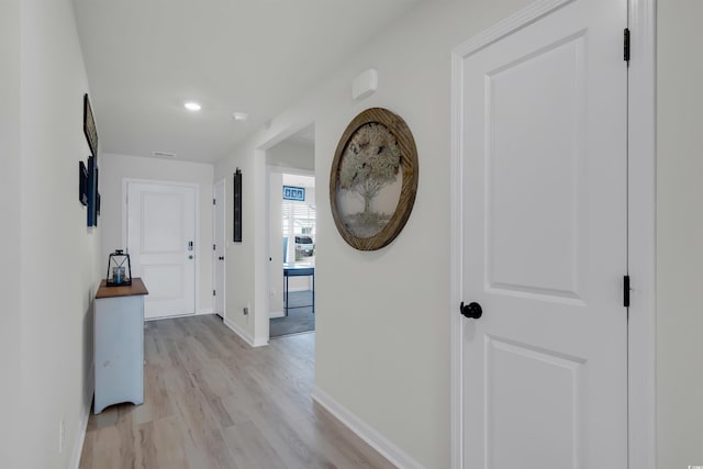 hallway with light wood-type flooring