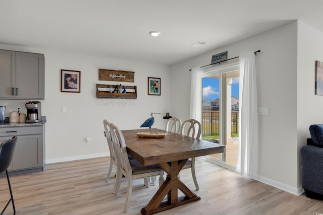 dining room with light hardwood / wood-style floors