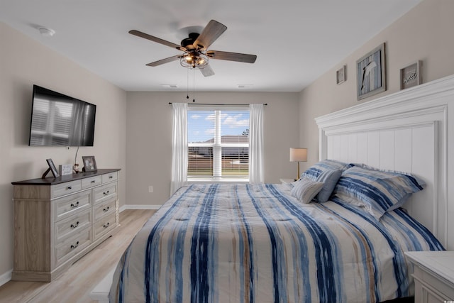 bedroom featuring ceiling fan and light hardwood / wood-style flooring