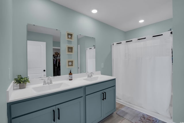 bathroom with vanity and shower / bath combo with shower curtain