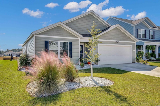 view of front facade featuring a front lawn and a garage