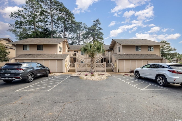 view of parking / parking lot with a garage