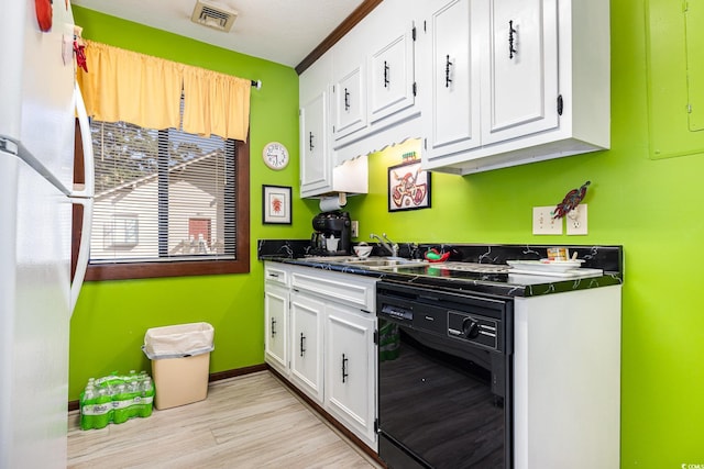 kitchen with black dishwasher, white cabinetry, light hardwood / wood-style flooring, ornamental molding, and white fridge