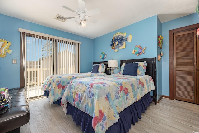 bedroom with ceiling fan, light wood-type flooring, and access to exterior