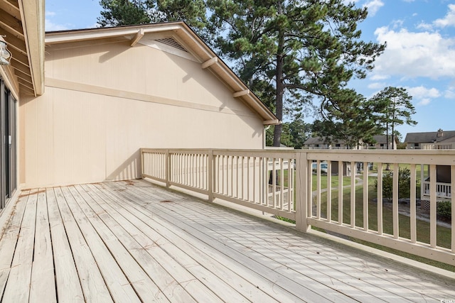 wooden terrace with a yard