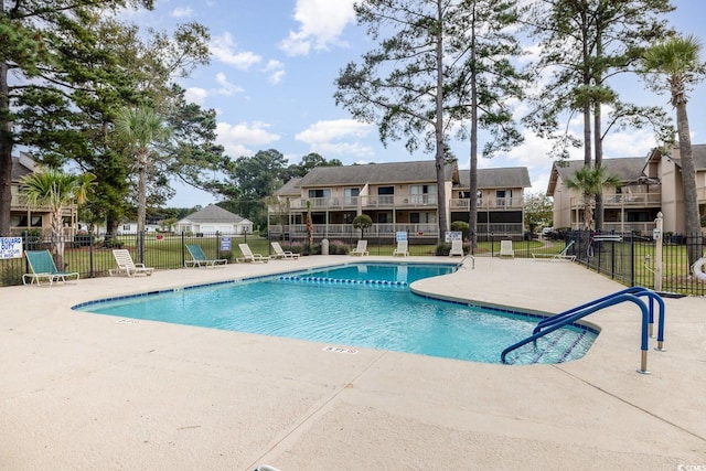 view of swimming pool with a patio