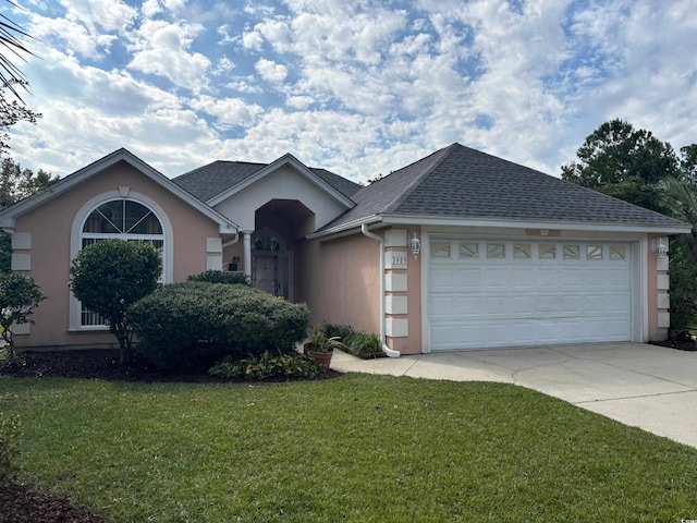 ranch-style home with a front lawn and a garage