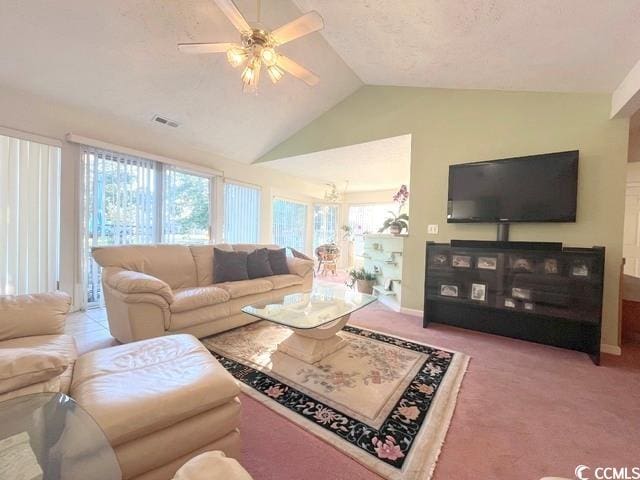 carpeted living room featuring ceiling fan and lofted ceiling