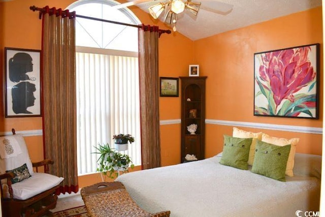 bedroom featuring multiple windows and ceiling fan