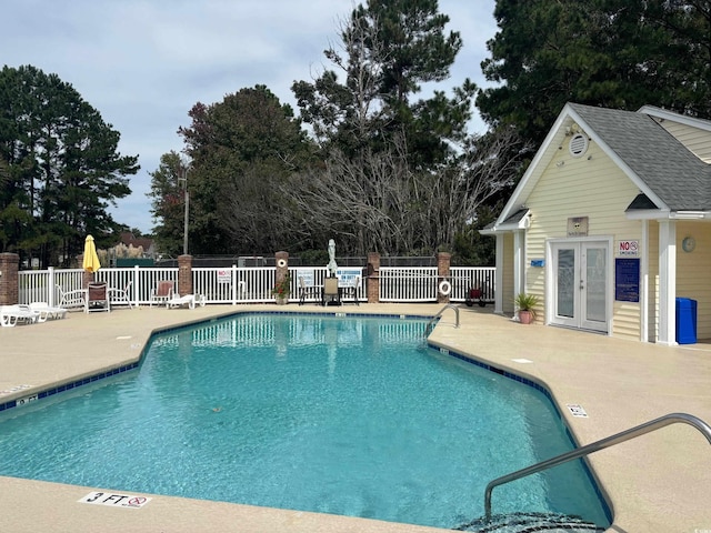 view of swimming pool featuring a patio