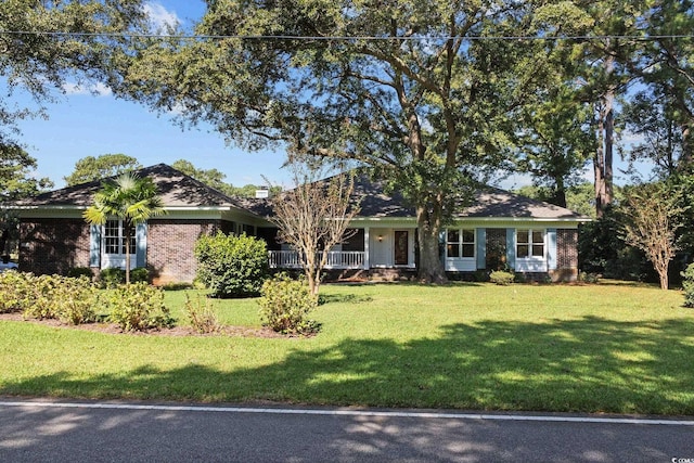 ranch-style house with a front lawn