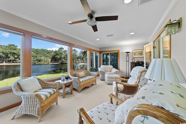 interior space with ceiling fan and a water view