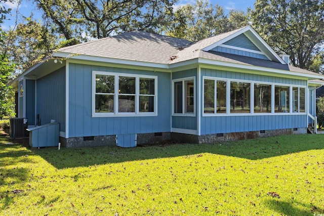 view of home's exterior with cooling unit, a lawn, and a sunroom