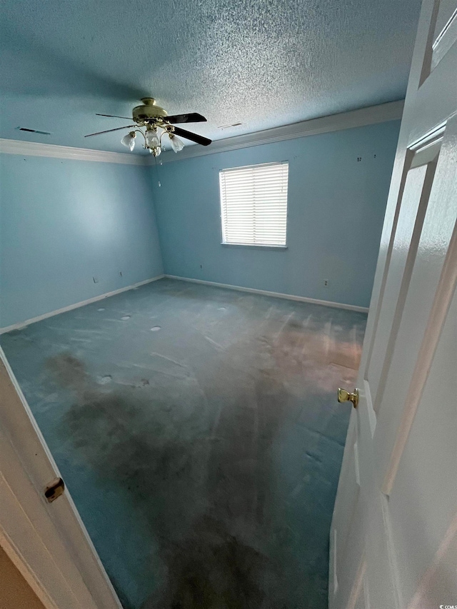 unfurnished room with crown molding, a textured ceiling, carpet floors, and ceiling fan