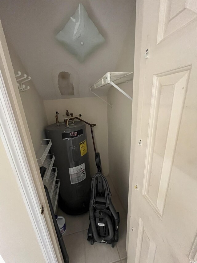 utility room with electric water heater