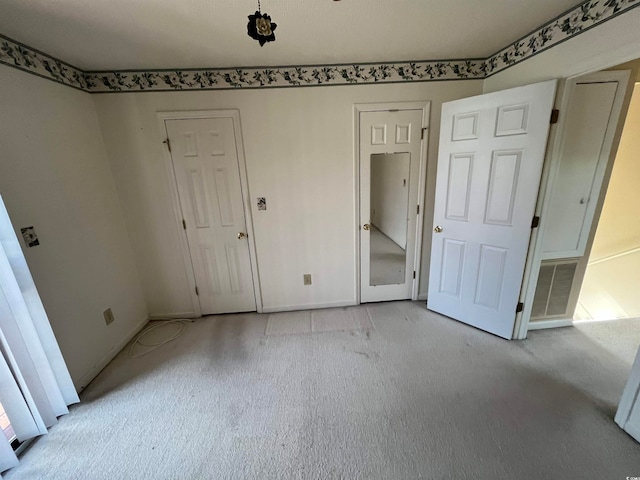 unfurnished bedroom with light carpet