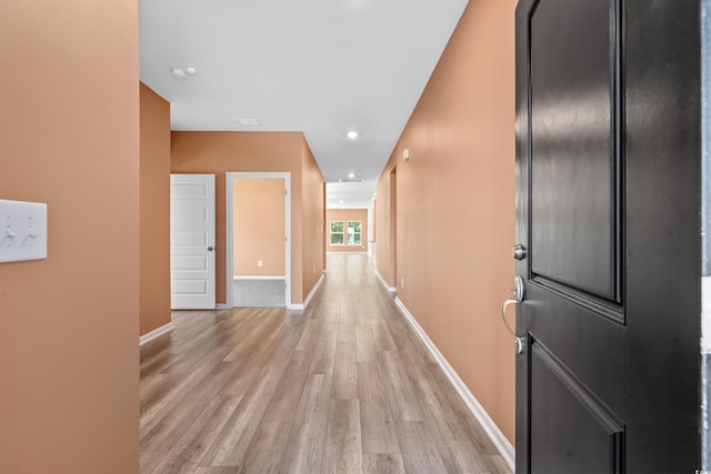 hallway featuring light hardwood / wood-style floors