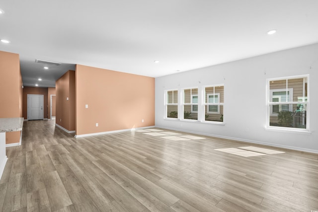 unfurnished living room with light hardwood / wood-style floors