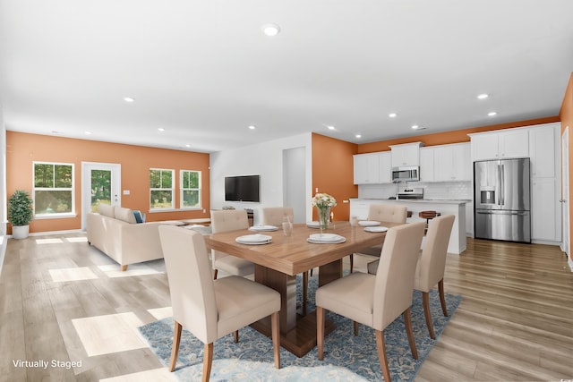 dining room with light hardwood / wood-style flooring