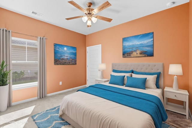 carpeted bedroom featuring ceiling fan